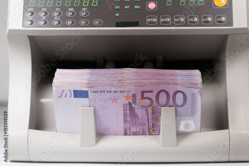 five hundred euro banknotes in a counting machine photo