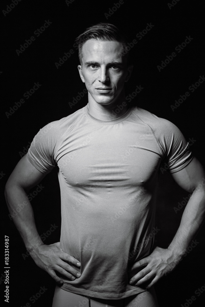 Portrait of bodybuilder shoor in studio on black background Portrait of bodybuilder shoor in studio on black background