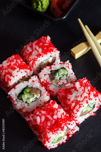 Sushi roll with salmon and cucumber.