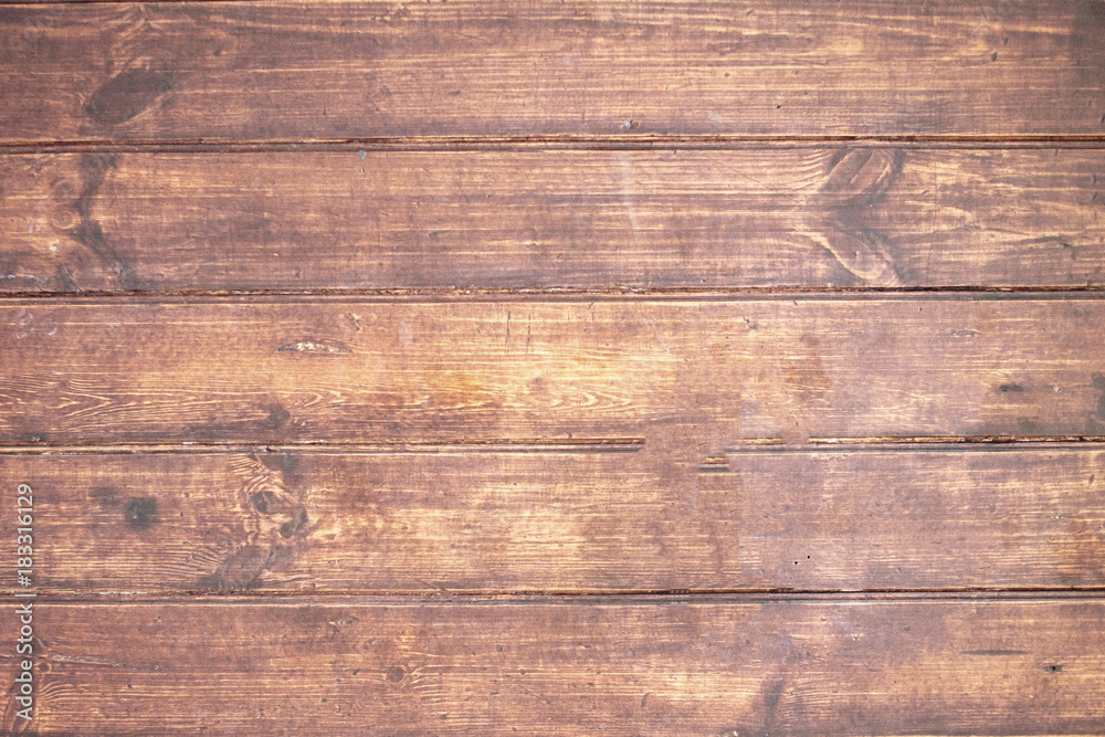 Naklejka premium Brown wooden background. Old vintage texture of bark wood, table or floor in vintage hipster style. Flat lay. Nature concept.