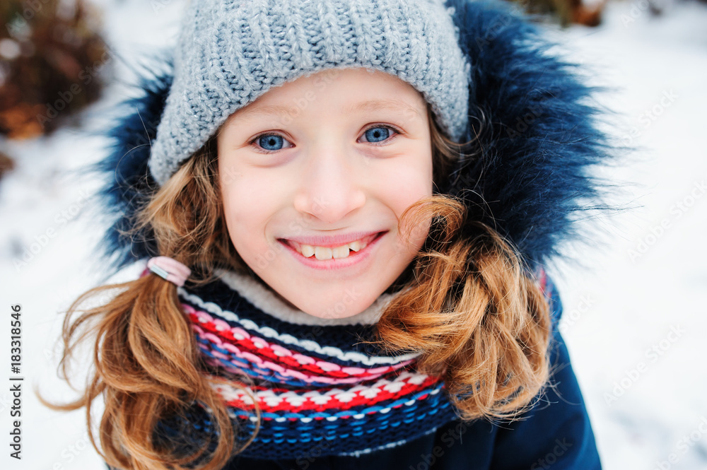 winter lifestyle portrait of happy kid girl playing snowballs on the walk on backyard winter lifestyle portrait of happy kid girl playing snowballs on the walk on backyard