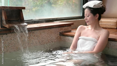 japanese girl enjoy the hot springs water