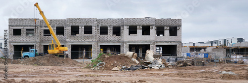 Panorama of a dity clay  construction site in a  poor European city. photo