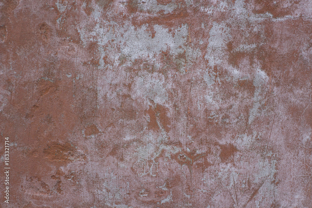 Fototapeta premium Red concrete wall with small cracks on the surface