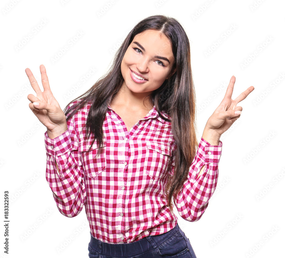 Beautiful smiling woman showing victory gesture on white background Beautiful smiling woman showing victory gesture on white background