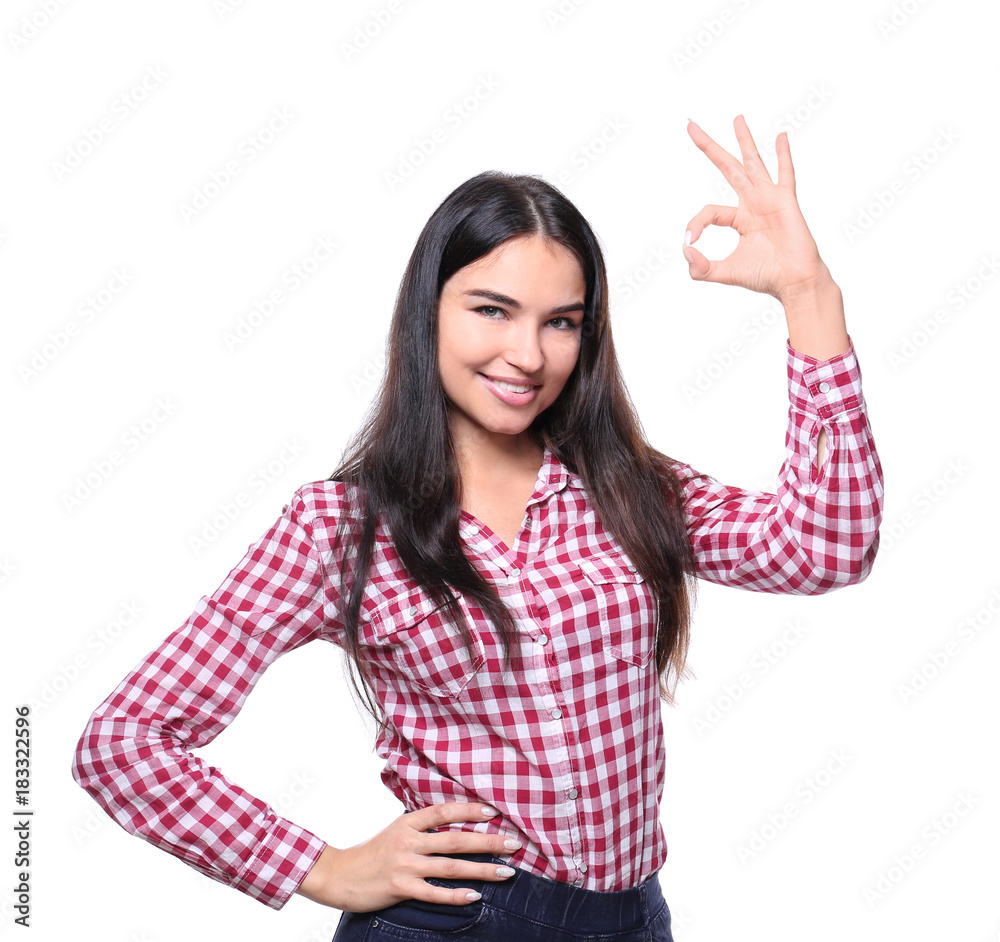 Beautiful smiling woman showing OK gesture on white background Beautiful smiling woman showing OK gesture on white background