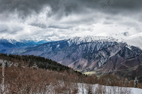Fototapeta Naklejka Na Ścianę i Meble -  Panoramic view on snow winter mountains and cloud sky. Caucasus Mountains. Svaneti region of Georgia.