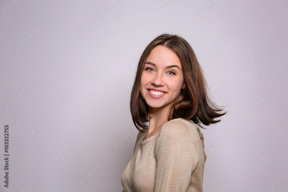Beautiful smiling woman on light background Beautiful smiling woman on light background