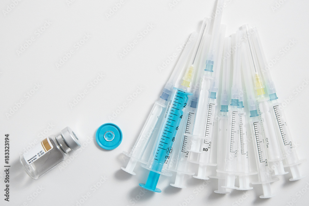 ampoule and syringe on white background, medical and health theme ampoule and syringe on white background, medical and health theme