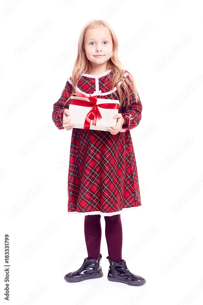 Isolated portrait of cute blonde little girl in checkered red dress holding gift box Isolated portrait of cute blonde little girl in checkered red dress holding gift box