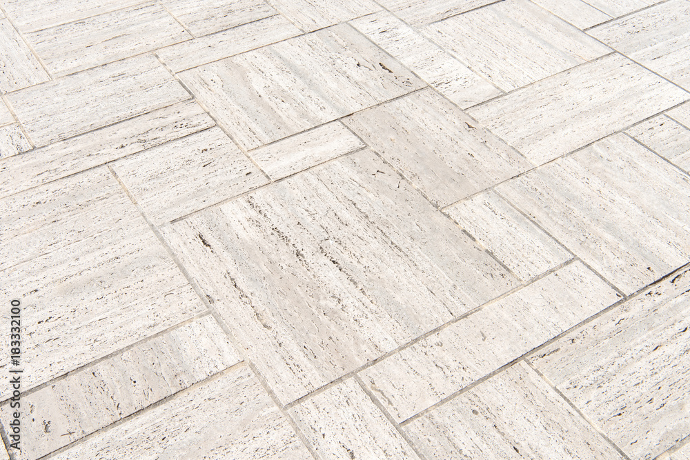 Naklejka premium patterned paving tiles, cement brick floor background.
