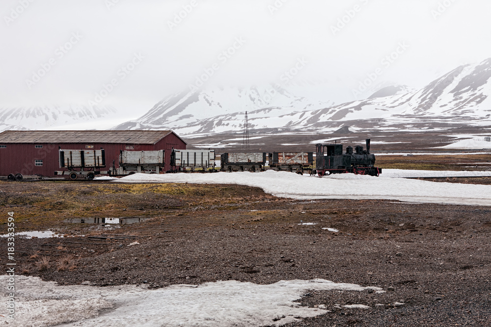 Old train and hut in Ny Alesund, Svalbard islands