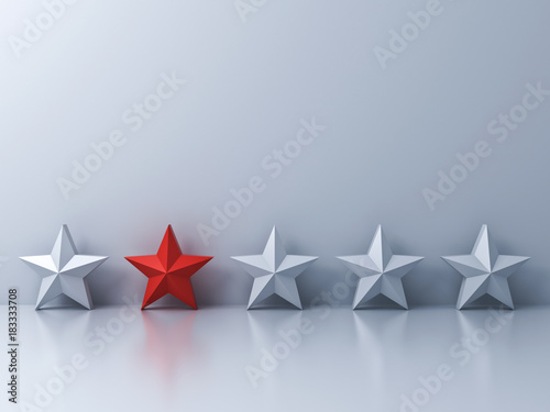 Fototapeta Naklejka Na Ścianę i Meble -  Stand out from the crowd and different concept , One red star different among white stars on white wall background with shadows and reflections . 3D rendering.