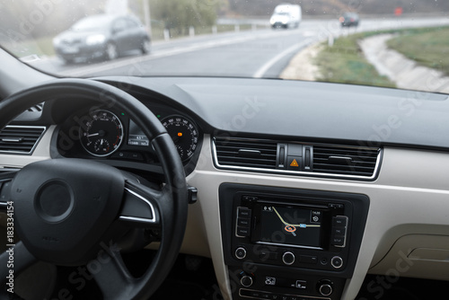 Car navigation system in modern car interior. © Lalandrew