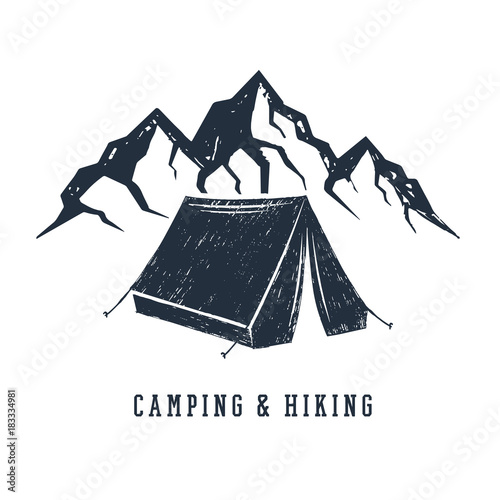Hand drawn inspirational label with mountains and camping tent textured vector illustrations and "Camping and hiking" lettering.
