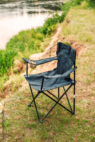 folding black chair for fishing and outdoor relaxation