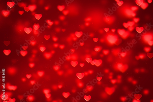 abstract christmas gradient red gradient background with bokeh glitter and red hearts shape flowing, valentine day love relationship holiday event festive concept