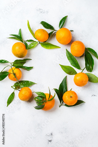 Organic healthy tangerine mandarine wreath on a table © aamulya