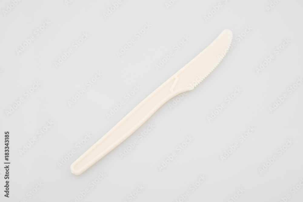 Single disposable plastic knife isolated over the white background Single disposable plastic knife isolated over the white background