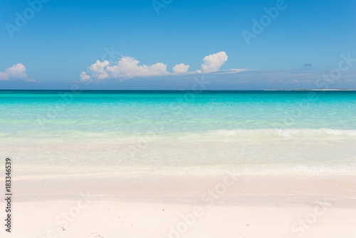 Beautiful shoreline with white sand and turquoise water in the Caribbean Sea. 