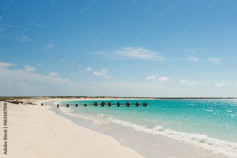 Heavenly-looking solitary beach with little pier in the Caribbean Sea. La Tortuga (Turtle) island, Venezuela. Heavenly-looking solitary beach with little pier in the Caribbean Sea. La Tortuga (Turtle) island, Venezuela.
