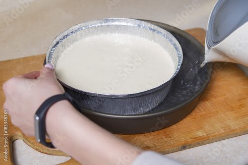 Woman making cheesecake dessert on her kitchen. No sugar, healthy homemade food. Proper nutrition