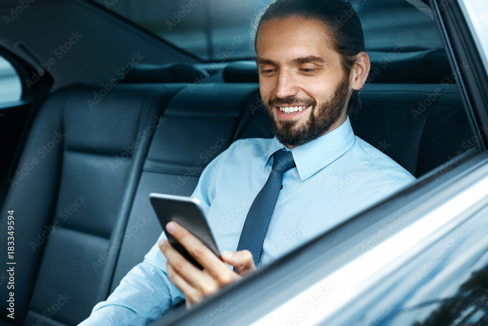 Young Successful Man Working On Phone Sitting In Car.
