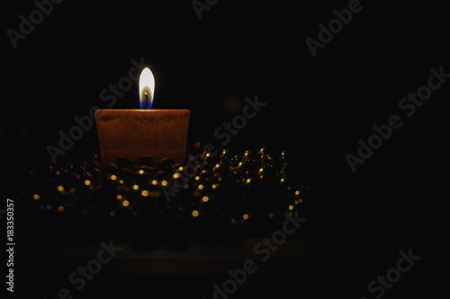 Bilde på lerret candle light.candle light isolated on black background