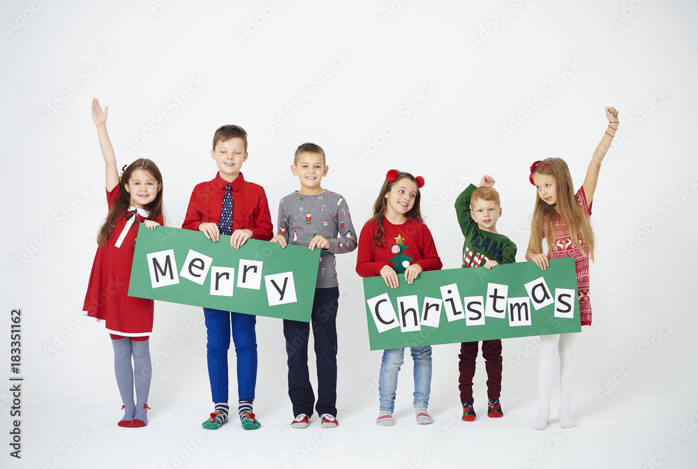 Fototapeta premium Cheerful children holding christmas decoration