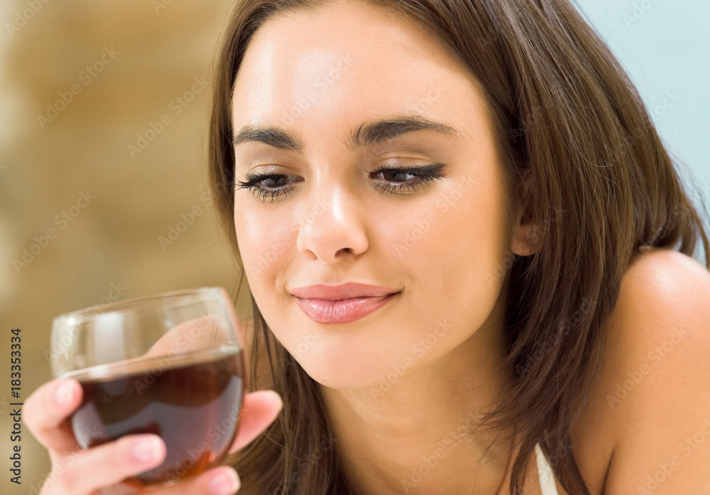 Young woman with glass of redwine Young woman with glass of redwine
