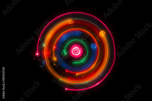Trails of multicolored radial lights blurred on black, can use background