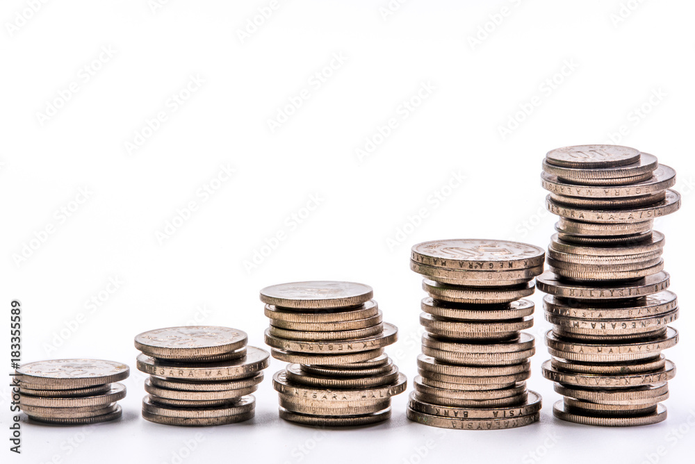 coins stacked isolated in a white background coins stacked isolated in a white background