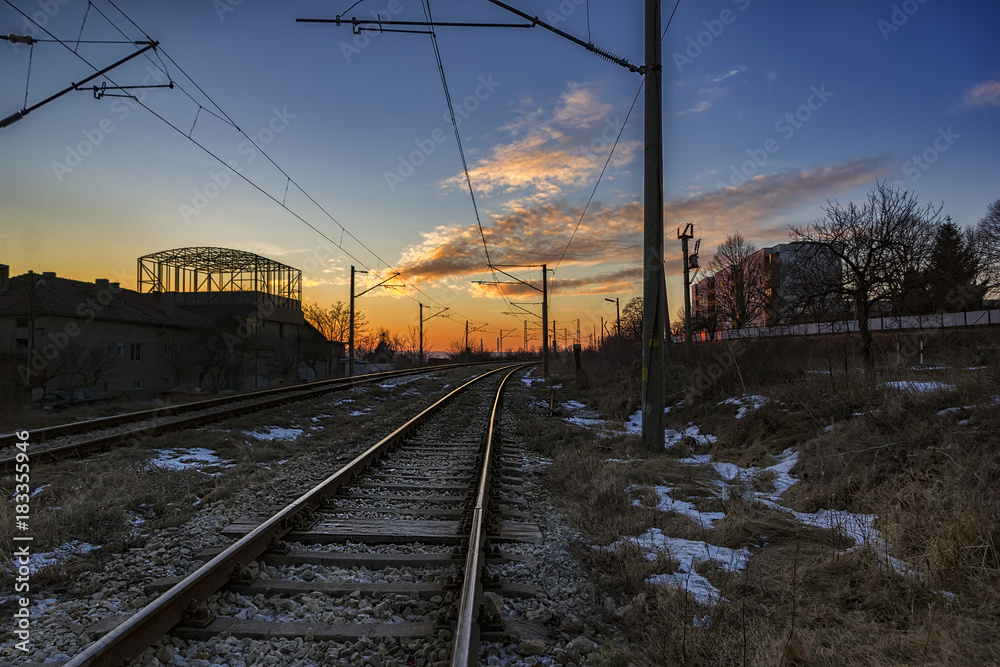 Industrial landscape with railroad and beauty colorful sky