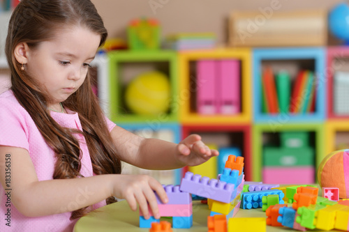 little girl playing in room