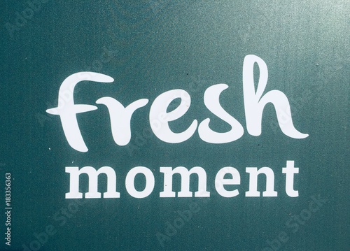 Fresh moment sign on a green background