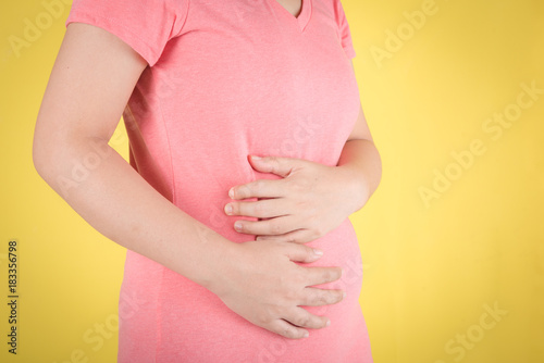 Wallpaper Mural Woman having abdominal pain, upset stomach or menstrual cramps Torontodigital.ca