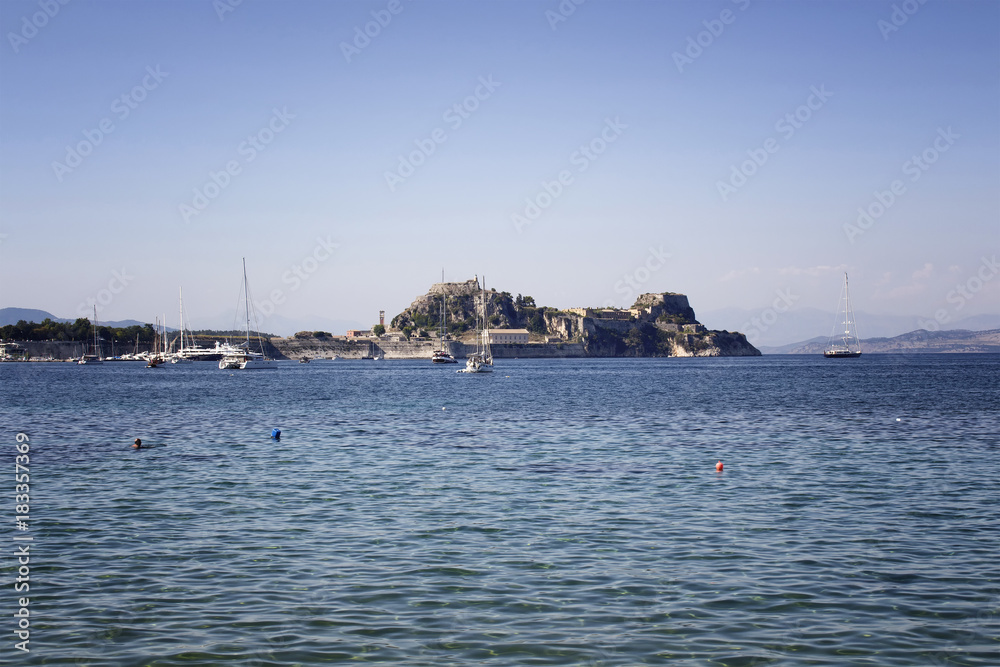 View of historical fortress and yachts in Corfu (Kerkyra). It's an island off Greece’s northwest coast in the Ionian Sea. Its cultural heritage reflects Venetian, French and British rule.
