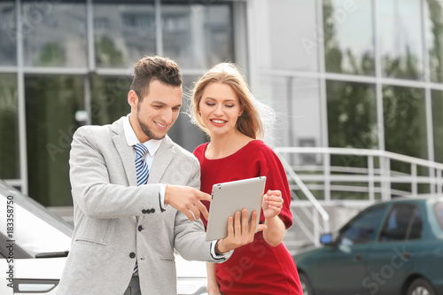 Salesman with tablet and cl...