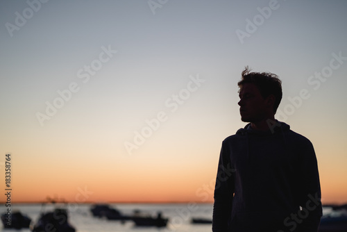 Man watching the sunrise in Portugal