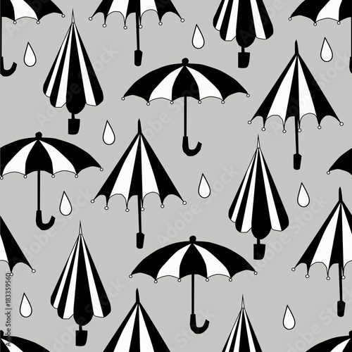 cartoon black and white umbrella seamless pattern on a gray background