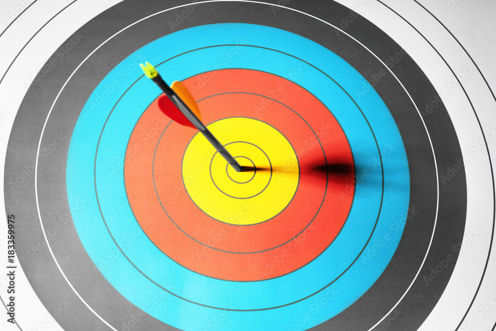 Arrow in the center of target for archery, closeup Arrow in the center of target for archery, closeup