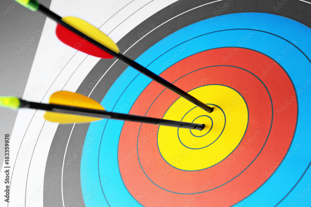 Arrows in the center of target for archery, closeup Arrows in the center of target for archery, closeup