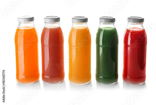 Bottles with juices on white background