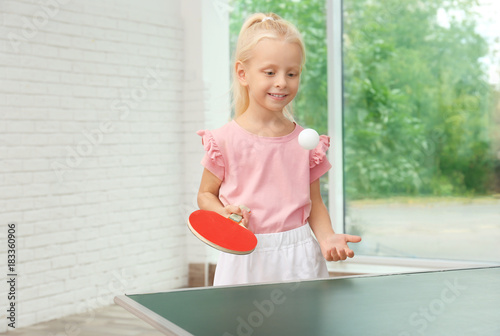 Cute little girl playing ta...