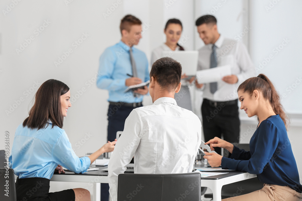 Team of young consulting experts on business meeting in office Team of young consulting experts on business meeting in office