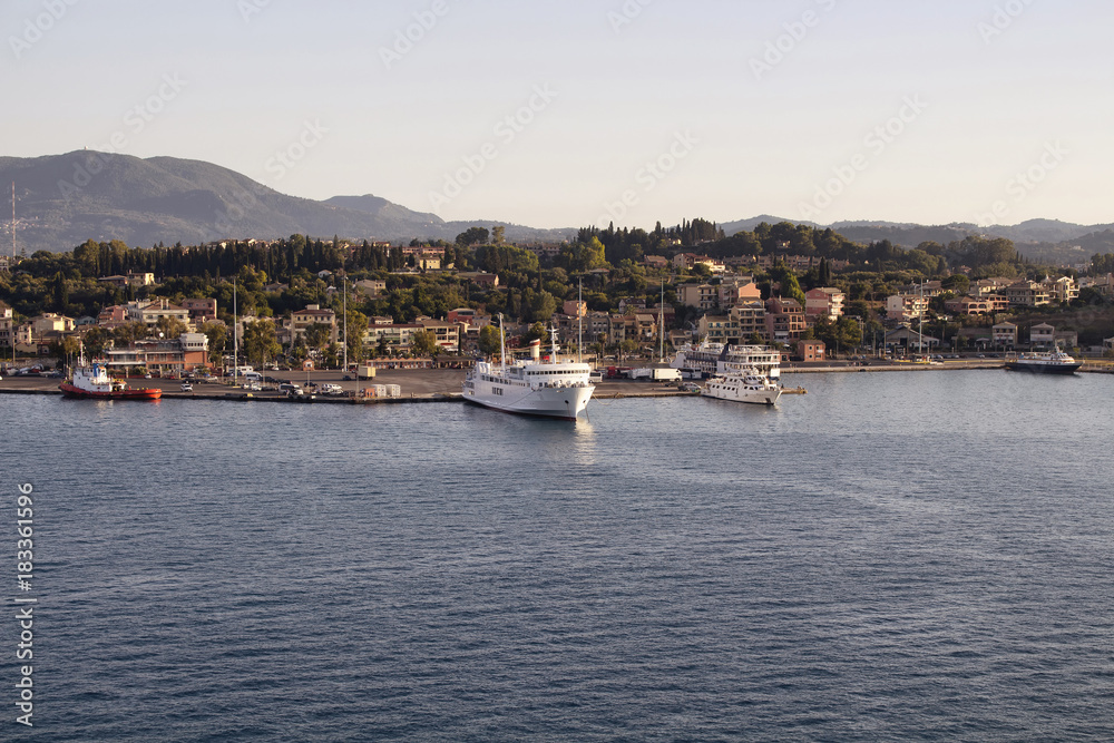 View of ships and Corfu (Kerkyra) town. It's an island off Greece’s northwest coast in the Ionian Sea. Its cultural heritage reflects Venetian, French and British rule.