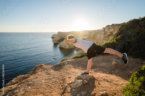 Balancing on a cliff in Portugal