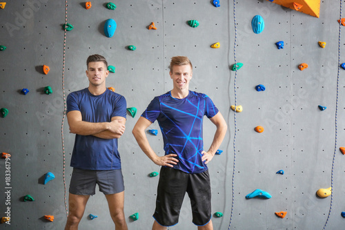 Young men in climbing gym