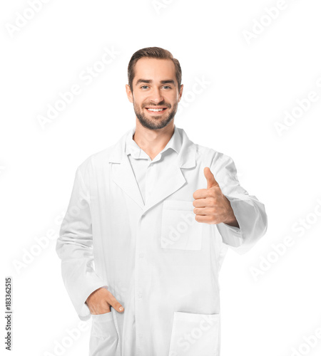 Young pharmacist on white b...