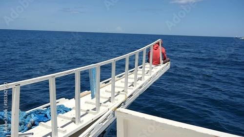 beautiful view off the side of a tranditional philipine sailing ship as it sails the open ocean photo